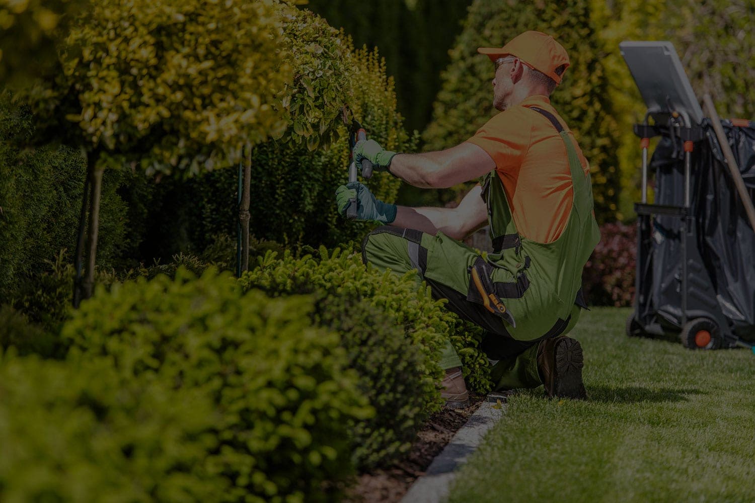 Pest control technician treating a residential property