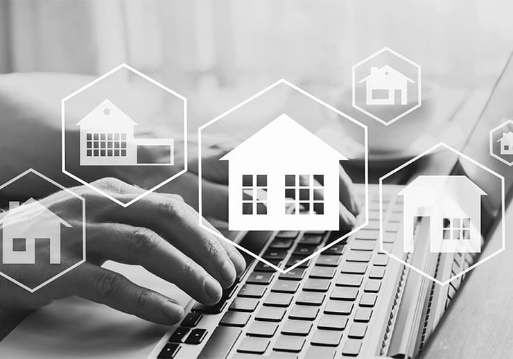 Loan officer reviewing mortgage paperwork with clients